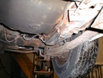 Under neath....seems prety good, when the guy said original he was not kidding, even the shocks had not been changed....