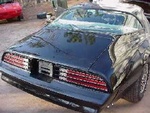 After the paint shop and ready for spoilers and new rubber seals. . . A very, BIG thank you to Dennis at allmusclecars.com who restored my Special Edition Trans Am.