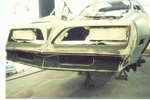 After the mechanical was done, it's off to the paint shop and she's down to the metal.  There was no rust anywhere: trunk, floor pans or on the body.  The trunk still has the factory paint and spare tire.