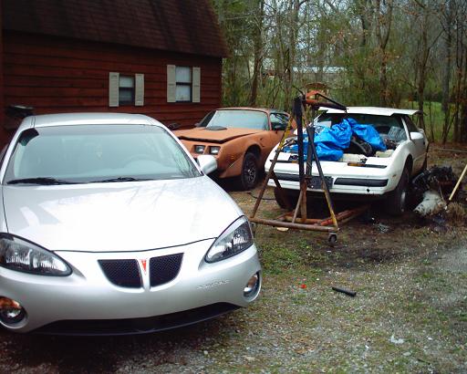 Here is my Pontiac "Collection". My wife's 2004 Grand Prix, the Y-84 and the 87 with the hoist holding the 455 oil pan off the frame.
