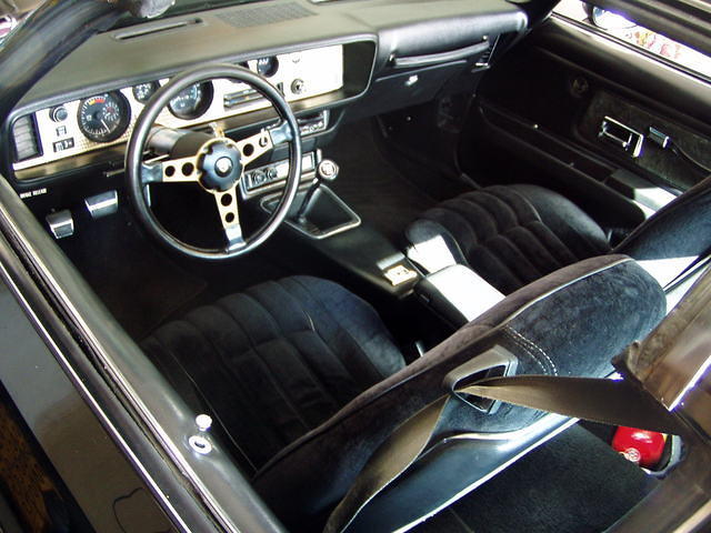The interior is in great shape - no dash cracks. It had the usual problems - sagging headliner and cracked console lid.  The lombardy cloth seats are in good condition.  I\'ve added an 8-track player.