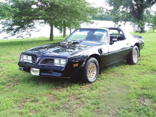 It has a nice black paint job, which was 2 years old when I bought it in 2004. Unfortunately no pinstripes or decals except for the rear spoiler. More photos from May 2004 when I picked up the SE are at: http://www.motortopia.com/album/
view/p/cars/t/...