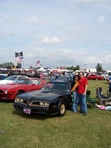 Club member Chris Dunnett and his wife on the Americana showfield with a 77 SE clone and a 73 T/A, both from Newcastle, England