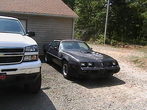 Its a 1979 olds 403 though! black on black with the red and silver bird