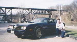 Here is a recent picture of me and my car taken for its first run in 2004 after a long cold winter