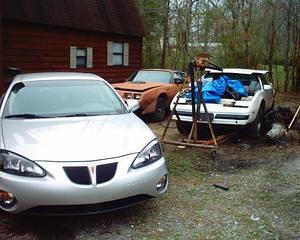 Here is my Pontiac "Collection". My wife's 2004 Grand Prix, the Y-84 and the 87 with the hoist holding the 455 oil pan off the frame.