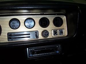 First bezel!  I did put a six speaker Kenwood system in the car.