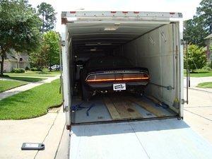 The car is waiting to be unloaded.  I have a video of it backing out of the truck