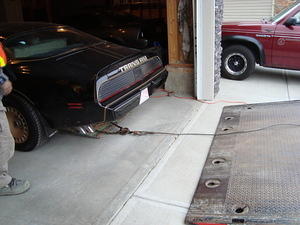 Being towed out of the garage