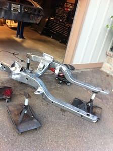 Sub frame blasted and sanded ready for self etching primer and paint. The stands are home made and roll the completed frame, suspension, engine and tranny for install from under the car later.