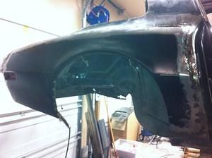 Right Quarter panel, stitched on and fitting nice.  It's even the right color.  Need to fill in the welds, grind and finish.